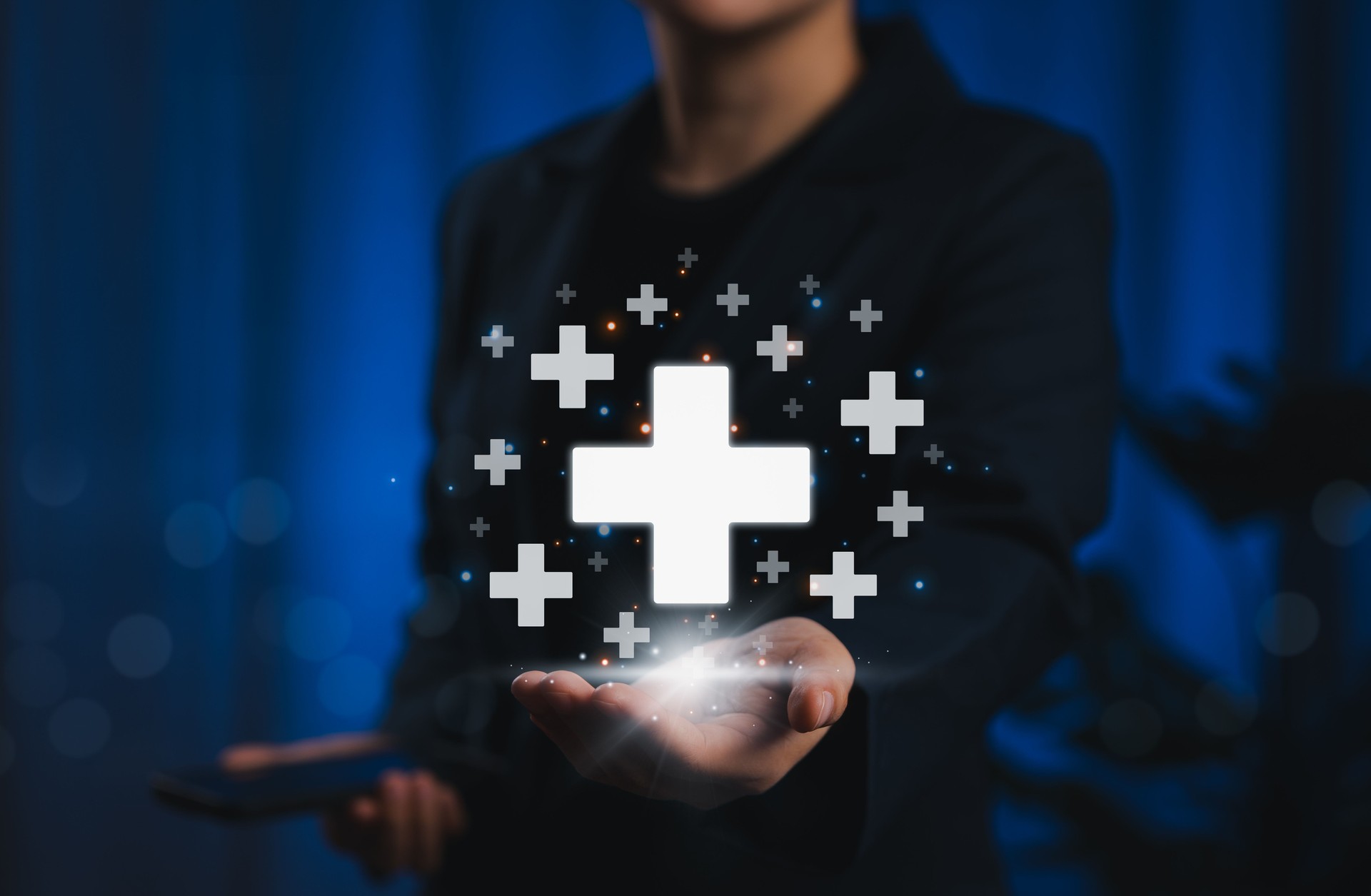 Digital Plus Icons for Positive Benefits. A business professional presents plus signs glowing, symbolizing benefits, positivity, added value, support, wellness services, insurance, medical, and health